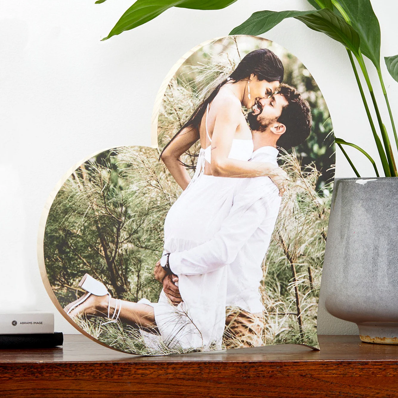Wedding couple photo on heart-shaped wood block